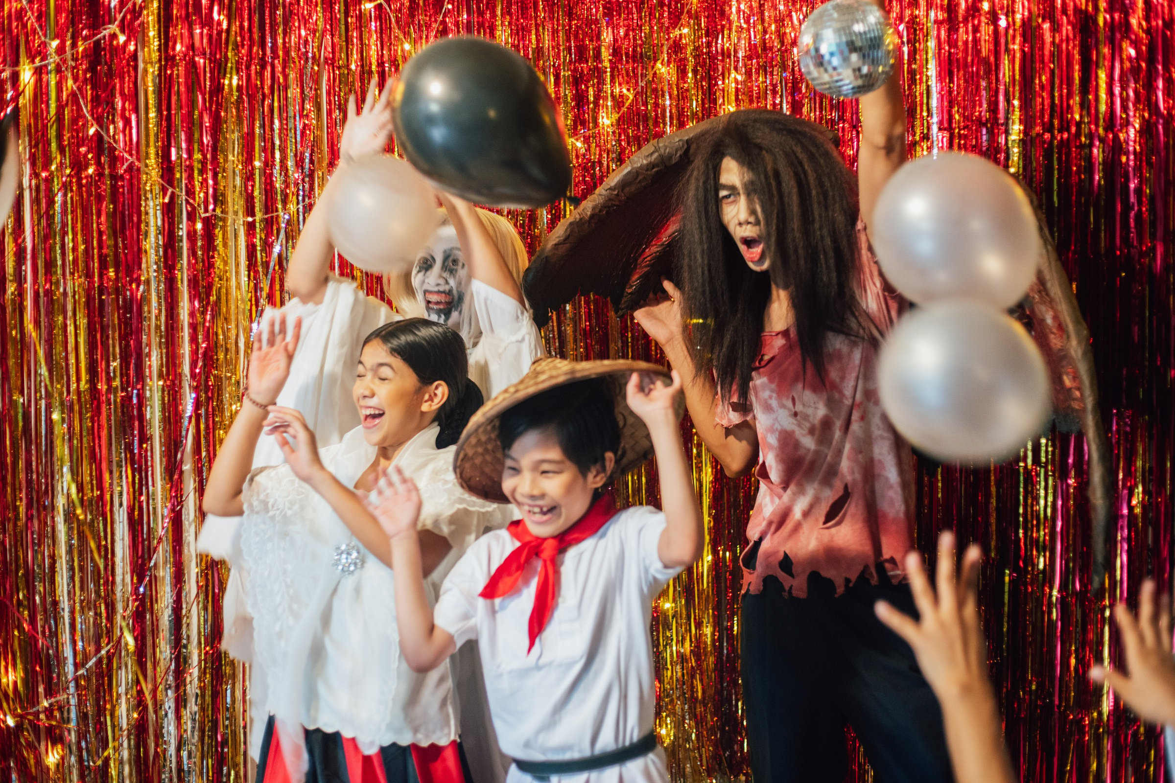 Family in Costumes at a Halloween Party