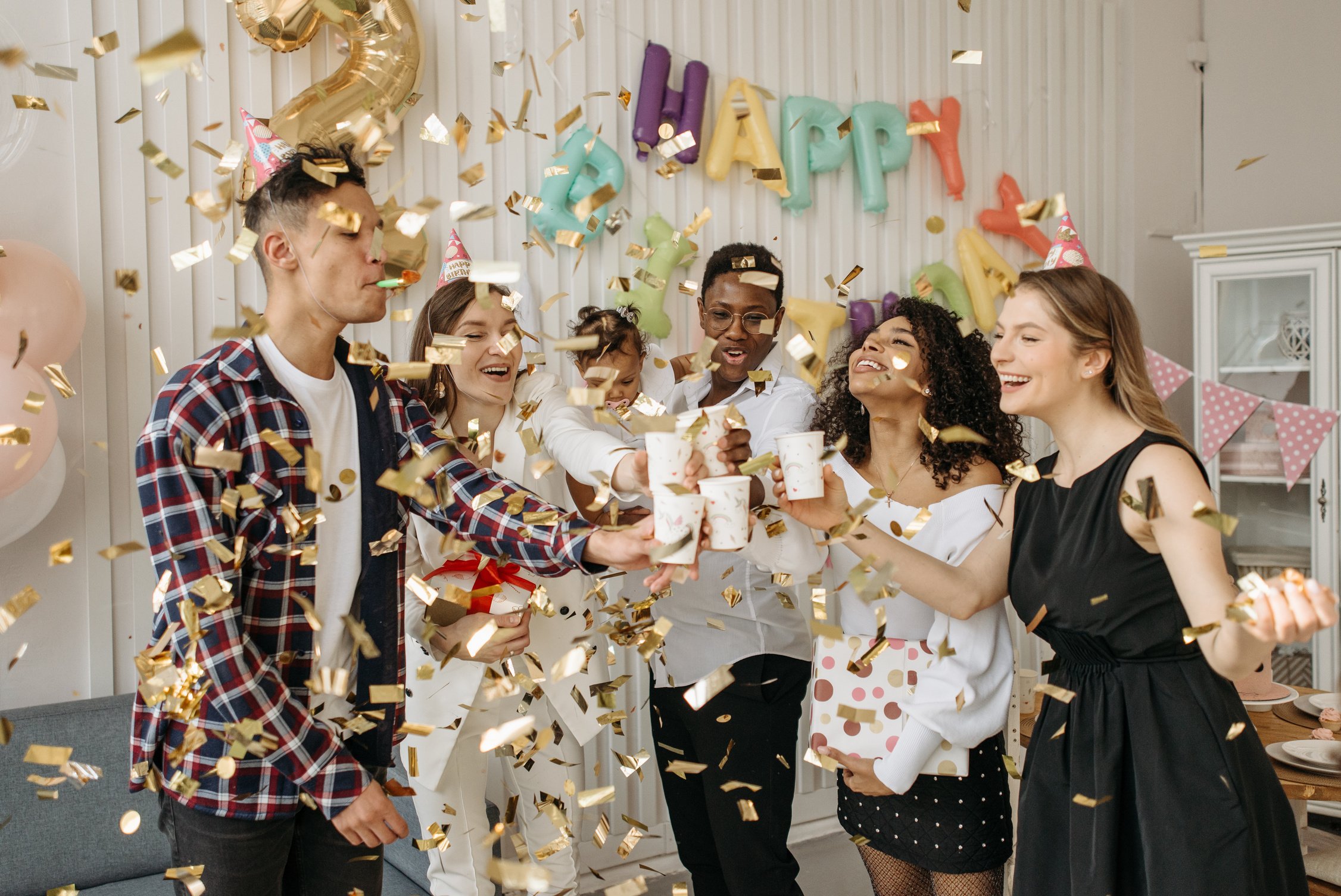 Family and Group of Friends Celebrating a Child's Birthday